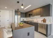 Thumbnail 7 of 31 - 3thirty3 new rochelle ny apartment high rise photo of kitchen with modern furnishings