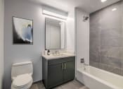 Thumbnail 5 of 31 - 3thirty3 new rochelle ny apartment high rise photo of bathroom with vanity and tub shower