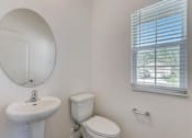 Thumbnail 40 of 56 - a bathroom with a toilet sink and mirror