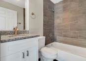 Thumbnail 18 of 28 - Addison Lane apartments in Gainesville, FL photo of a bathroom with a toilet sink and bathtub
