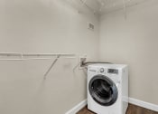 Thumbnail 19 of 28 - Addison Lane Apartment homes in Gainesville Florida photo of photo of a laundry room with a washer and dryer