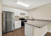 Thumbnail 10 of 28 - Addison Lane apartments in Gainesville, FL photo of stainless steel appliances