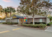 Thumbnail 25 of 28 - Addison Lane Apartment homes in Gainesville Florida photo of photo of a building with a black awning and balloons in front of it