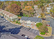 Thumbnail 22 of 23 - Element at 4411 Macon Apartments A parking lot with a building in the background.