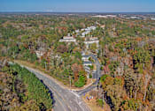 Thumbnail 20 of 23 - Element at 4411 Macon Apartments A road with a curve and a crosswalk in the middle of it.