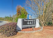 Thumbnail 23 of 23 - Element at 4411 Macon Apartments A sign for The Element at 4411 APARTMENT HOMES is in front of a road.