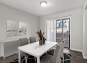 Thumbnail 6 of 23 - Element at 4411 Macon Apartments A dining room with a white table and chairs.