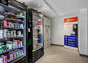 Thumbnail 22 of 31 - A vending machine with a variety of drinks and a sign that says "we clean it".