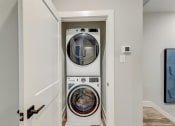 Thumbnail 30 of 56 - a washer and dryer in a laundry room