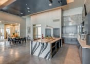 Thumbnail 15 of 34 - a large kitchen with a large island and a dining table