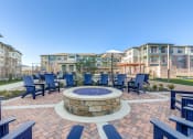 Thumbnail 27 of 34 - the preserve at ballantyne commons courtyard with blue chairs and a fire pit