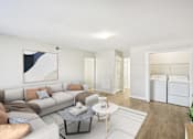 Thumbnail 5 of 20 - Spacious living room in affordable Marietta apartment with wood-style flooring and open layout
