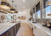Thumbnail 37 of 56 - a large kitchen with marble counter tops and stainless steel appliances