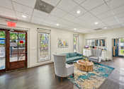 Thumbnail 16 of 20 - Resident lounge at Amber Grove Apartments in Marietta GA with community seating and decor