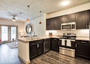 Thumbnail 12 of 28 - Sawgrass Creek Apartments in New Port Richey Florida photo of kitchen with stainless steel appliance