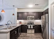 Thumbnail 13 of 28 - Sawgrass Creek Apartments in New Port Richey Florida photo of modern kitchen