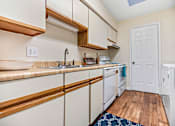 Thumbnail 7 of 16 - Savanna_Ga_Apartments_Greentree_Kitchen Hardwood Flooring
