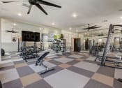 Thumbnail 39 of 56 -  Denton, TX Houses For Rent - Carmel Villas - Spacious Fitness Center With Dumbells, Full Body Mirrors, Ceiling Fans, Workout Bench, Squat Rack, And Strength Training Machines
