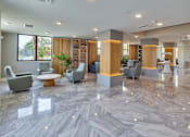 Thumbnail 25 of 36 - Well-appointed club room interior with multiple seating options and contemporary furnishings.