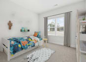 Thumbnail 14 of 26 - Harris Trail Luxury Townhomes for rent Richmond Hill, GA photo of a bedroom with a bed and a large window