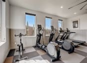 Thumbnail 40 of 56 - the gym has plenty of exercise equipment and views of the city