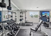 Thumbnail 3 of 40 - 24-hour fitness center with cardio machines and free weights at Hendersonville TN apartments