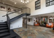 Thumbnail 9 of 16 - a staircase leads up to the second floor of the home
