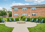 Thumbnail 38 of 40 - A brick building with a green lawn in front.