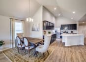 Thumbnail 3 of 24 - Dining Room and Kitchen View at Amber Pines at Fosters Ridge, Texas, 77384