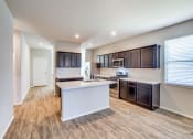 Thumbnail 5 of 24 - Wood Floor Kitchen at Amber Pines at Fosters Ridge, Conroe, TX, 77384