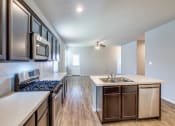 Thumbnail 6 of 24 - Open Concept Kitchen at Amber Pines at Fosters Ridge, Texas, 77384