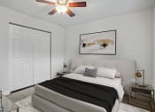Thumbnail 8 of 28 - Addison Lane Apartment homes in Gainesville Florida photo of a bedroom with white walls and a ceiling fan