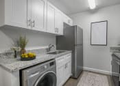 Thumbnail 6 of 28 - Addison Lane Apartment homes in Gainesville Florida photo of kitchen with stainless steel appliances