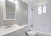 Thumbnail 8 of 12 - Affinitee at Pine Lake Apartments in Pine Lake, GA photo of a bathroom with a sink toilet and a bath tub