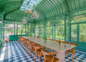 Thumbnail 7 of 16 - Affinitee at Stone Mountain Apartments photo of the pavillon with a long table and chairs