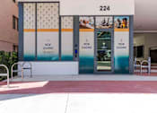 Thumbnail 26 of 37 - Exterior view of the leasing office at a pet-friendly Miami Beach apartment community, welcoming residents and visitors.