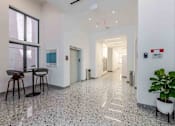 Thumbnail 25 of 37 - Hallway in a pet-friendly Miami Beach apartment community, featuring clean design, bright lighting, and easy access to residences.