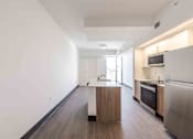 Thumbnail 10 of 37 - Pet-friendly home with a modern kitchen featuring energy-efficient appliances in a Miami Beach apartment.