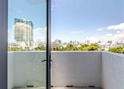 Thumbnail 13 of 37 - Pet-friendly home with a private balcony offering outdoor space and views in a Miami Beach apartment.