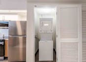 Thumbnail 14 of 37 - In-unit washer and dryer in a pet-friendly Miami Beach apartment, providing residents with the convenience and privacy of laundry at home.