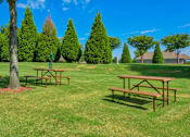 Thumbnail 13 of 15 - 2 & 3-Bedroom Apartments for Rent in Little Rock, AR – Capitol Hill – Outside area with park tables and plenty of grass space
