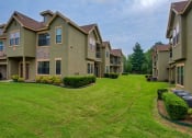 Thumbnail 21 of 25 - Parc at Rogers apartments surrounded by grass