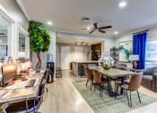 Thumbnail 4 of 17 - Modern Apartments in Houston, TX for Rent- Artisan West-  clubhouse with table and chairs