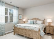 Thumbnail 20 of 62 - Myrtle Beach, SC Homes-The Palmer at Carolina Forest-Bedroom with Wood Plank Flooring, Faux Wood Blinds, and High Ceilings