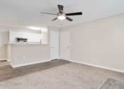 Thumbnail 8 of 23 - Ashford at Spring Lake apartments in Atlanta Georgia photo of living room with ceiling fan