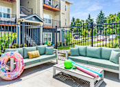 Thumbnail 29 of 47 - the preserve at ballantyne commons apartment patio with couches and tables