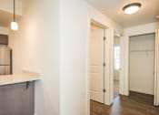 Thumbnail 9 of 47 - a renovated kitchen and living room with a door to a closet