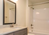 Thumbnail 14 of 47 - the preserve at ballantyne commons apartment bathroom with sink toilet and shower