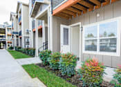Thumbnail 41 of 47 - an exterior view of an apartment building with a sidewalk