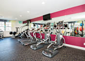 Thumbnail 26 of 47 - Pet-Friendly Luxury Apartments in Vancouver, WA - Autumn Grove - Fitness Center with Treadmills, Free Weights, Strength Training Equipment, Workout Benches, and Windows.